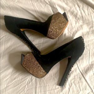 Black and gold platform peep toe heels